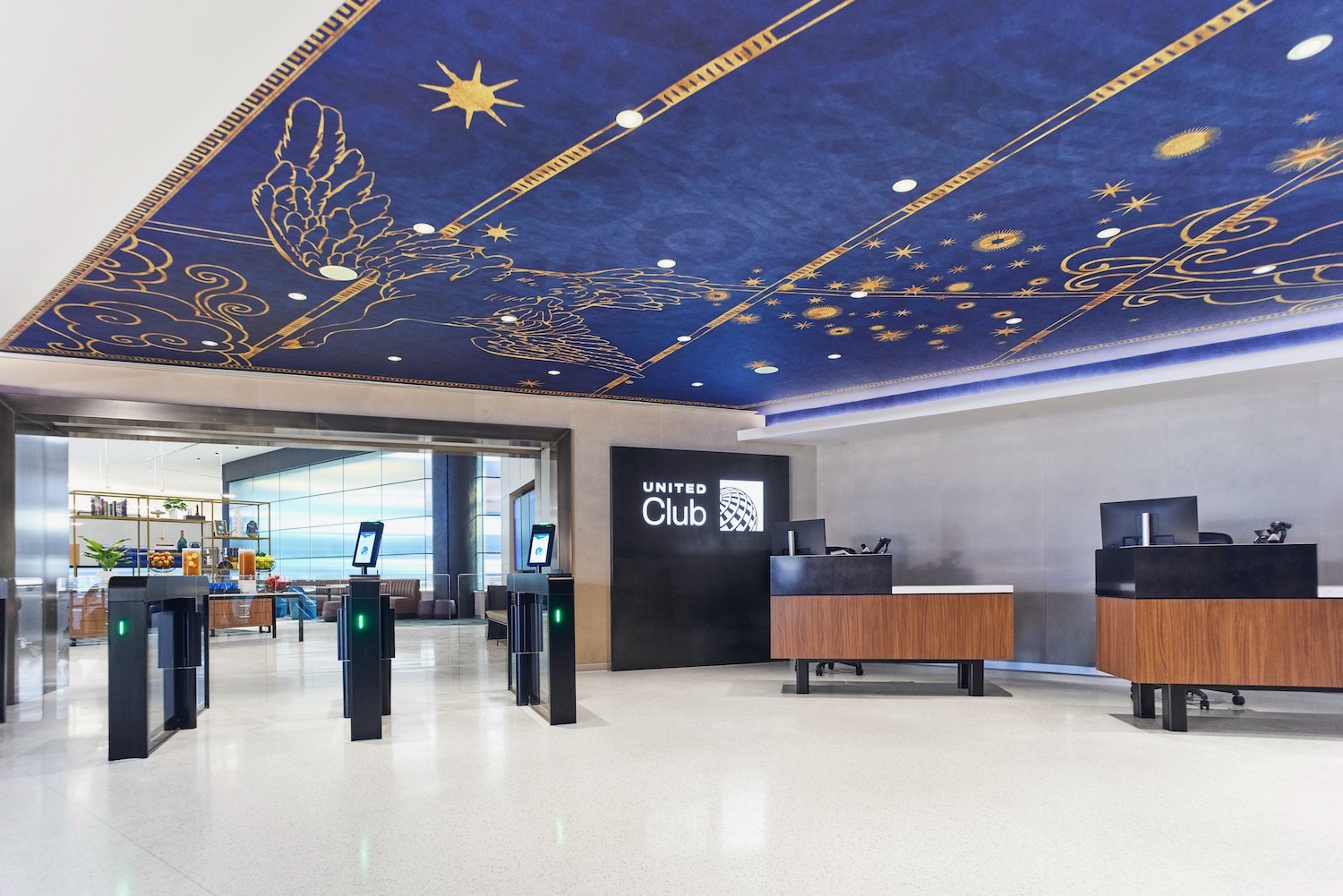 a lobby with a blue ceiling and a blue painted ceiling
