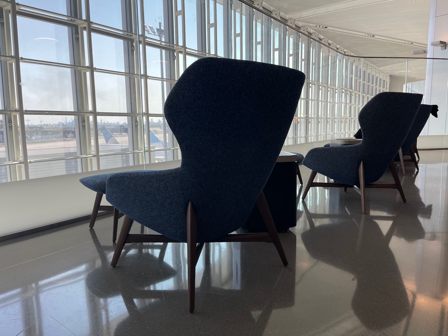 a group of chairs in a room with windows