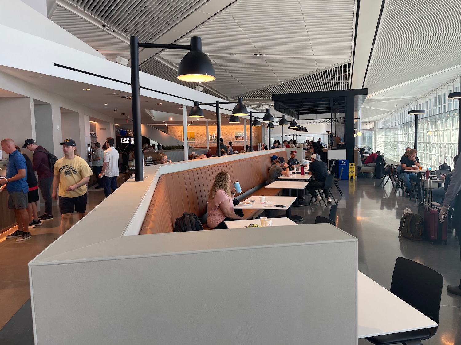 people sitting at tables in a building