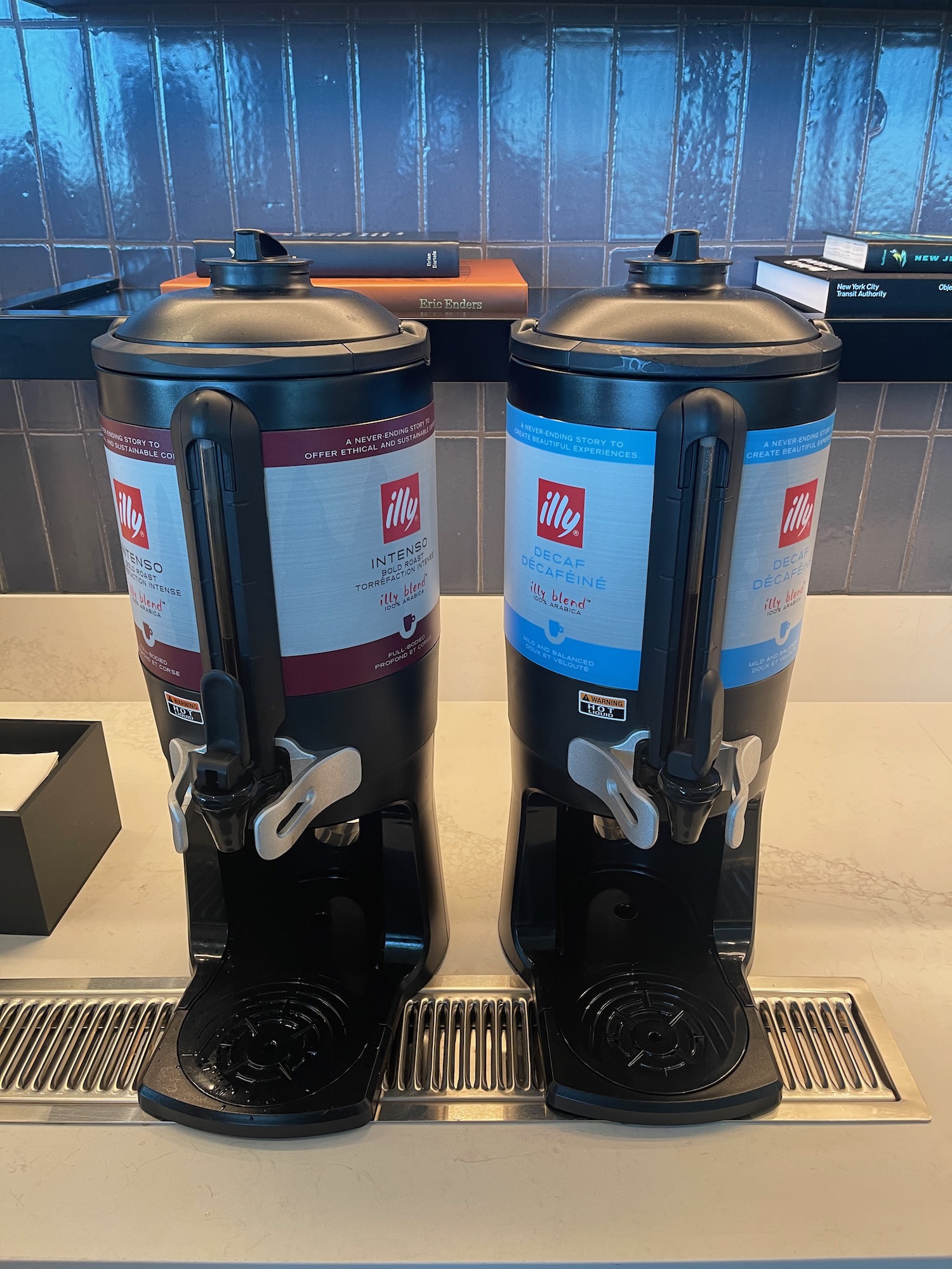 two black and white containers on a counter