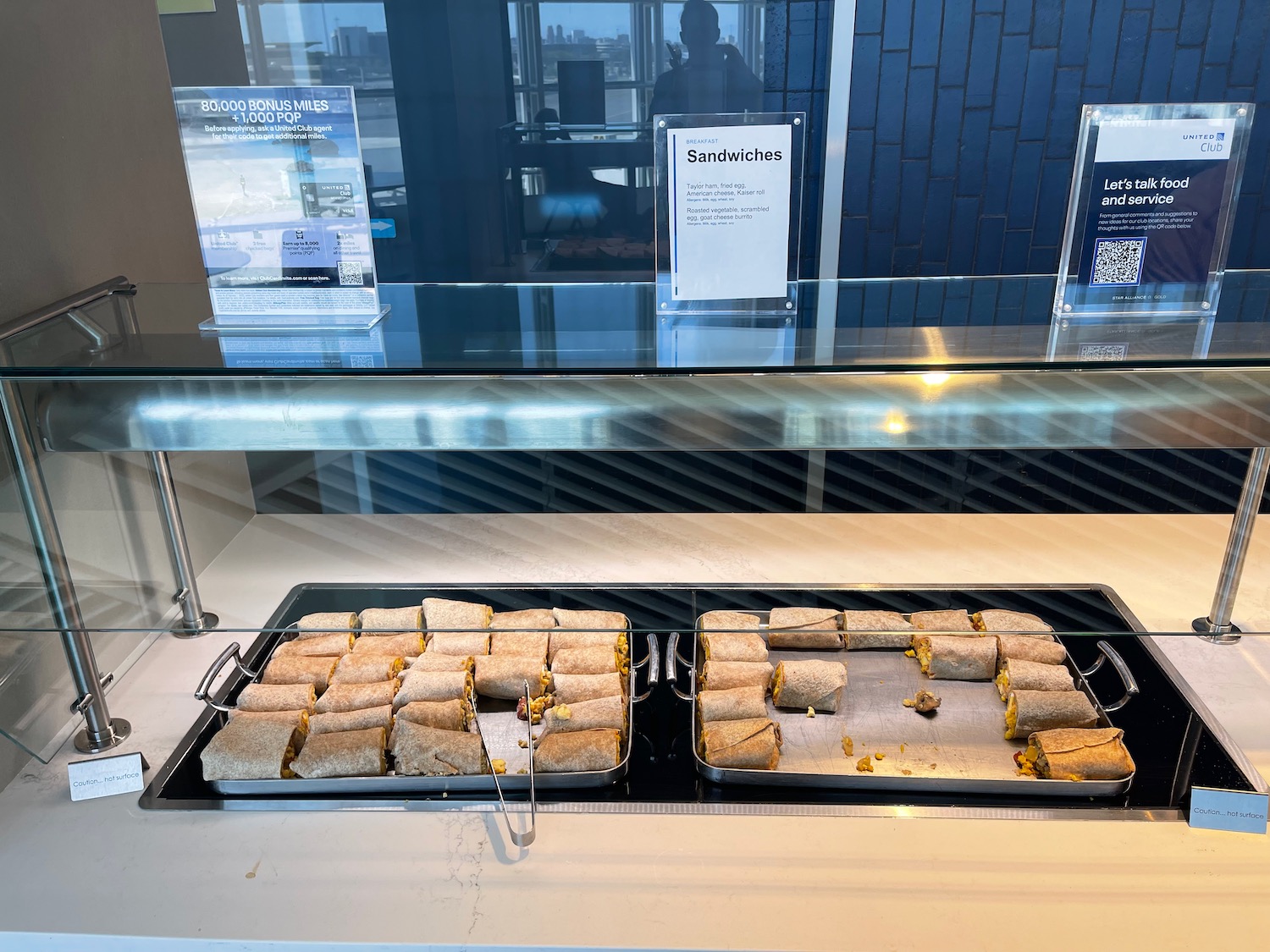 a trays of sandwiches on a counter