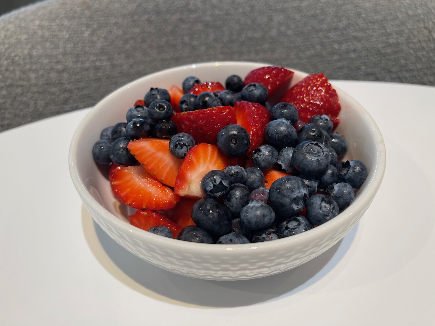 a bowl of blueberries and strawberries
