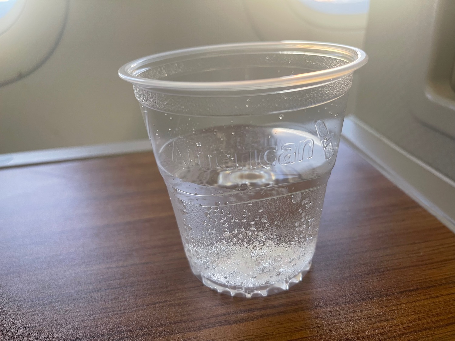 a plastic cup with a clear liquid inside