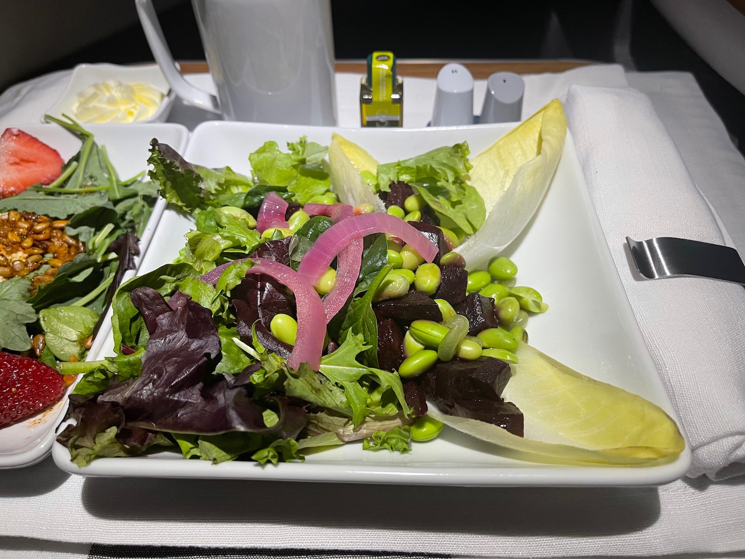 a plate of salad on a table