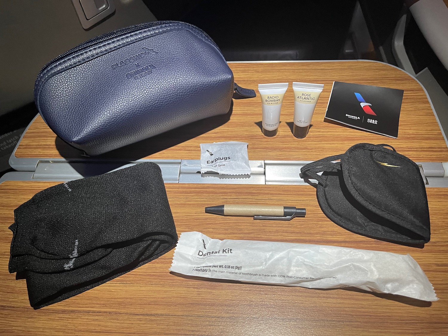 a table with a small bag and a small toiletries