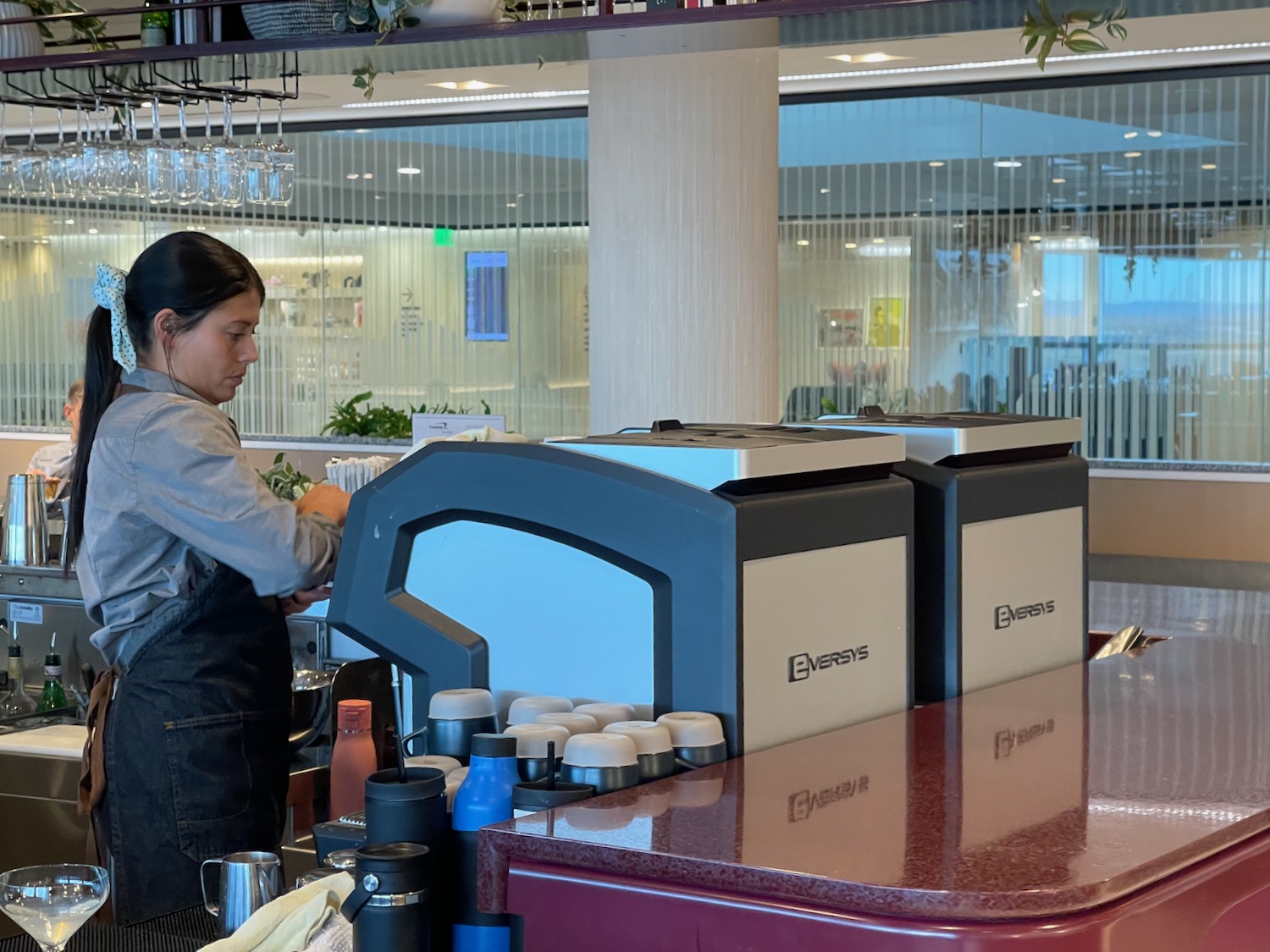 a woman standing behind a counter