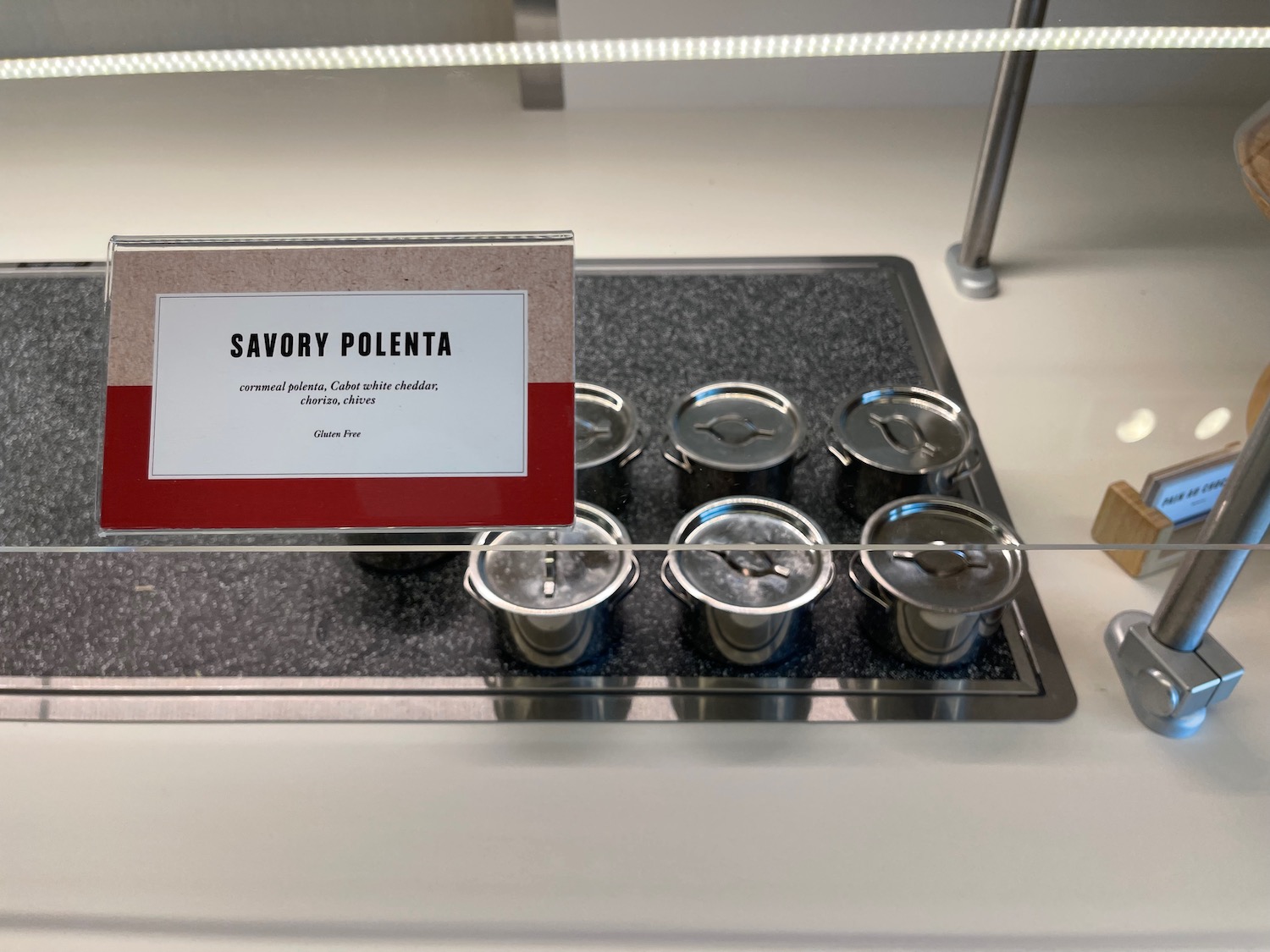 a group of silver containers on a tray