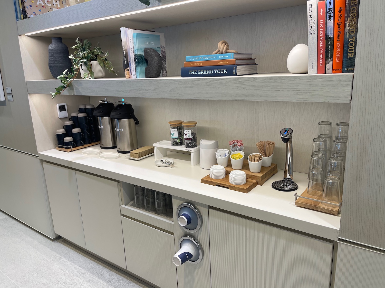 a kitchen counter with shelves and books