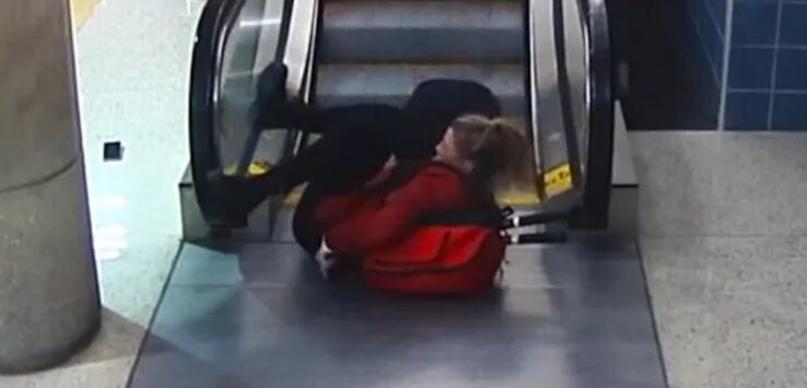 Delta Flight attendant Falls Down Escalator