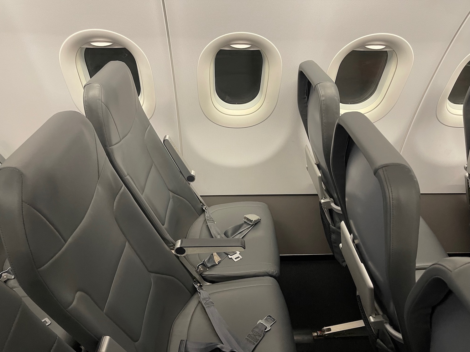 seats in an airplane with windows