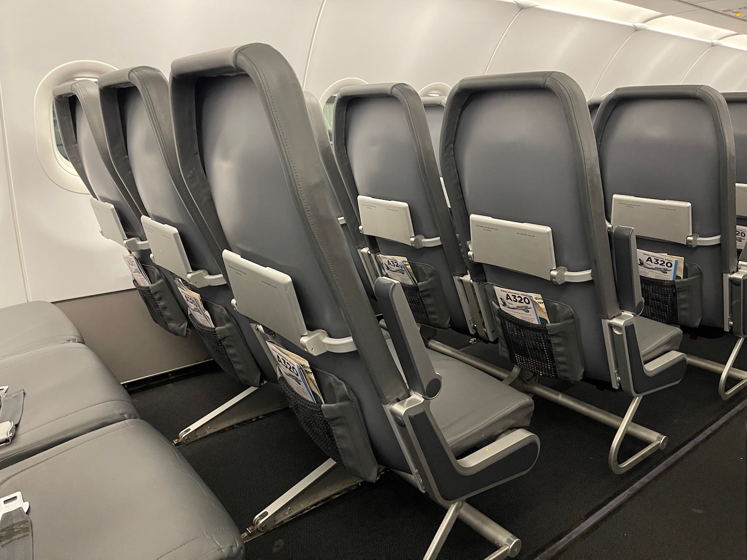 a row of grey seats