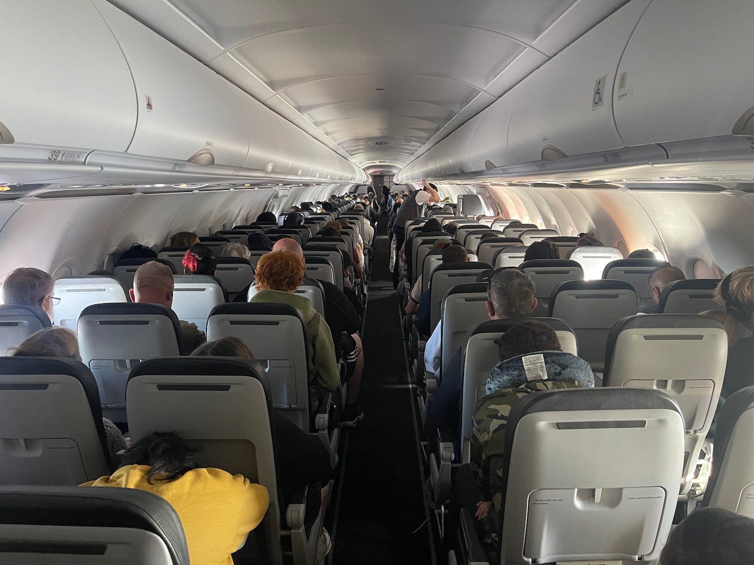 a group of people sitting in an airplane