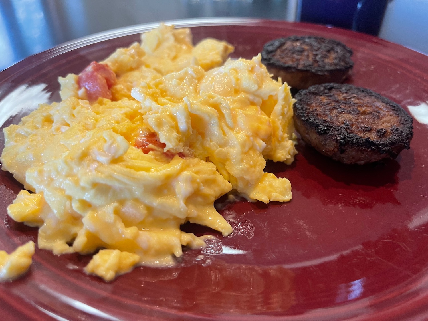 a plate of scrambled eggs and meatballs