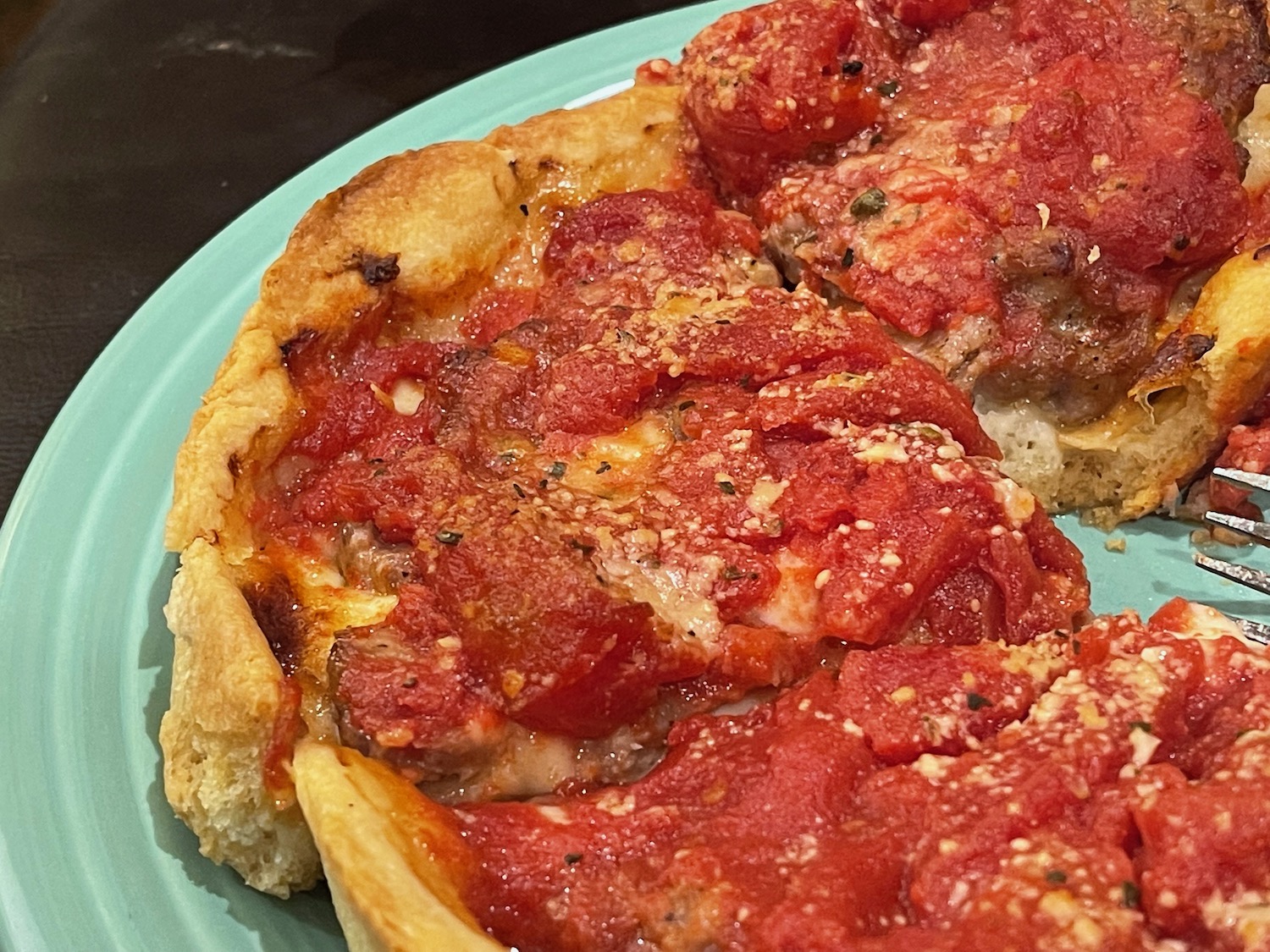 a deep dish pizza on a plate