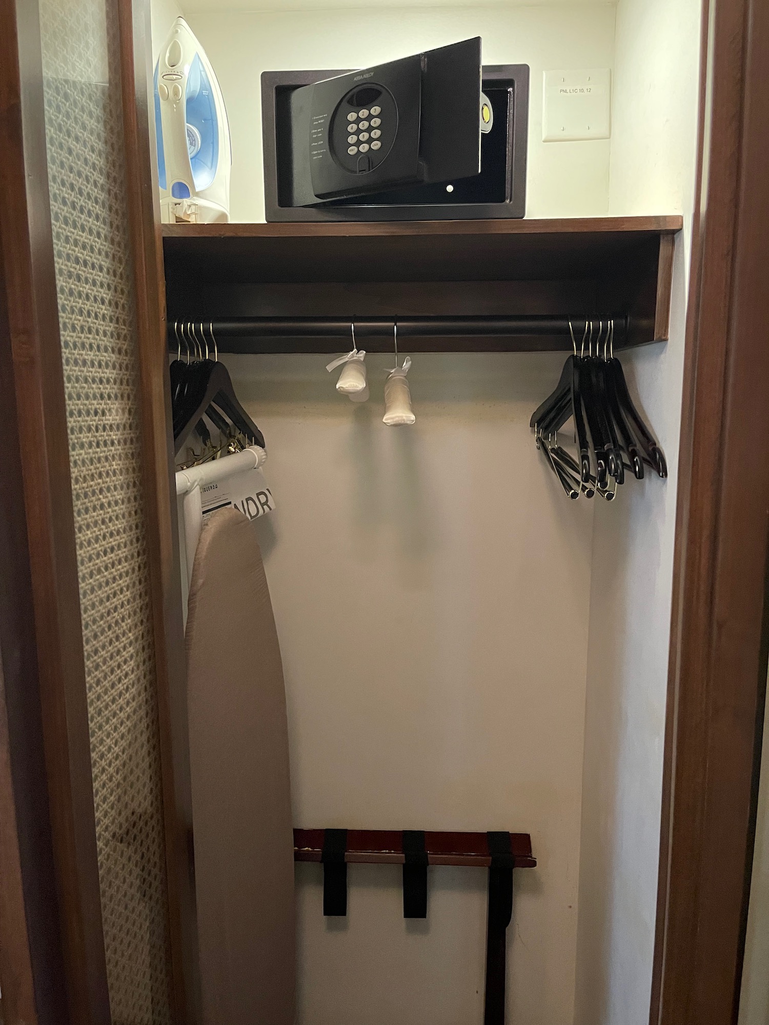 a closet with a safe and swingers