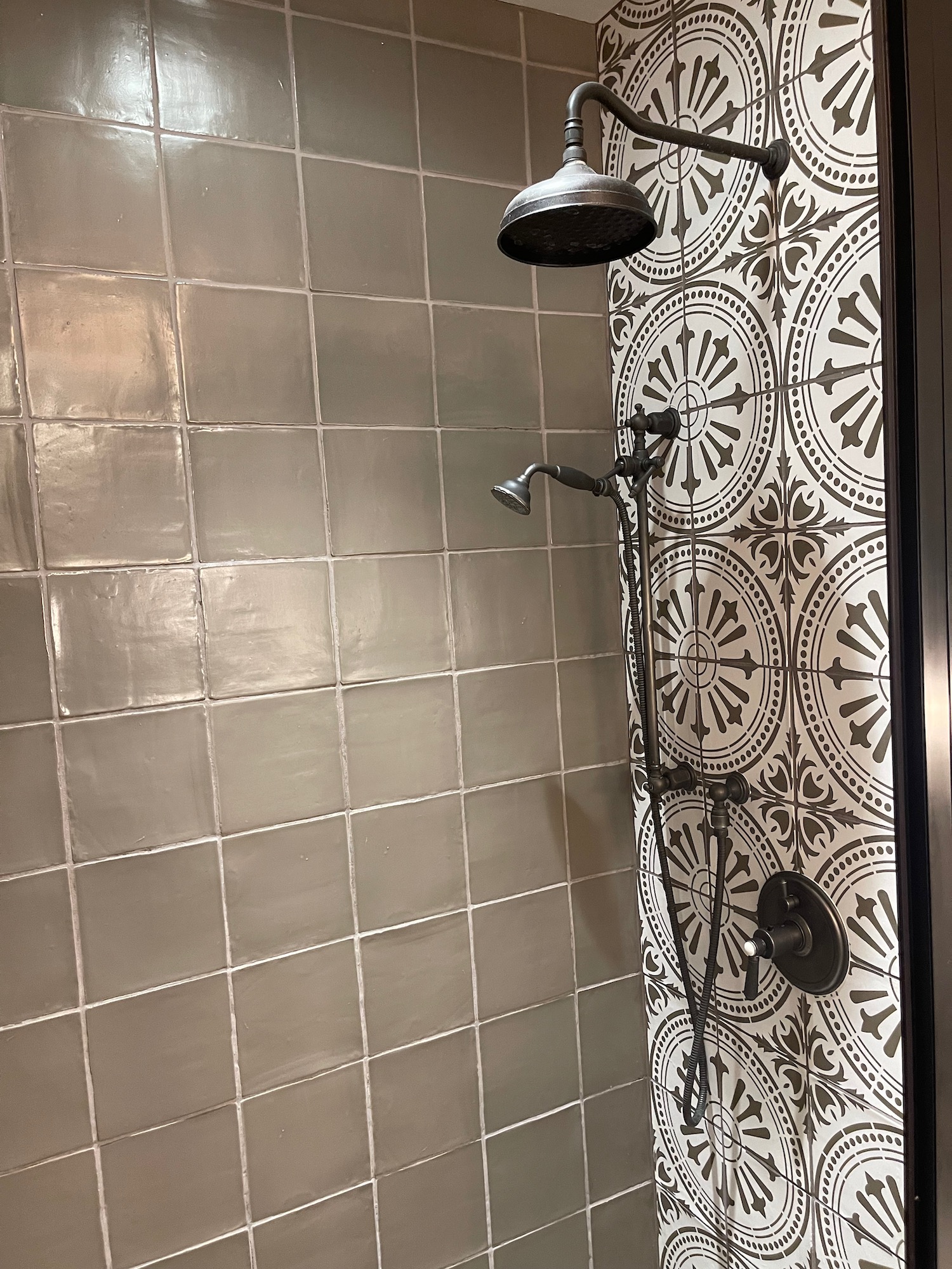 a shower head and shower head in a bathroom