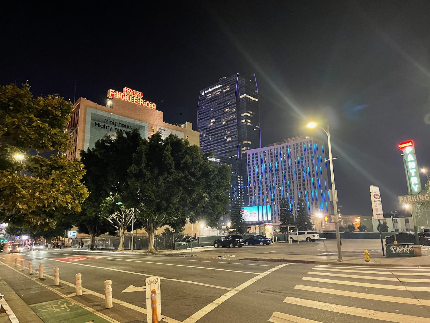 a city street with buildings and trees