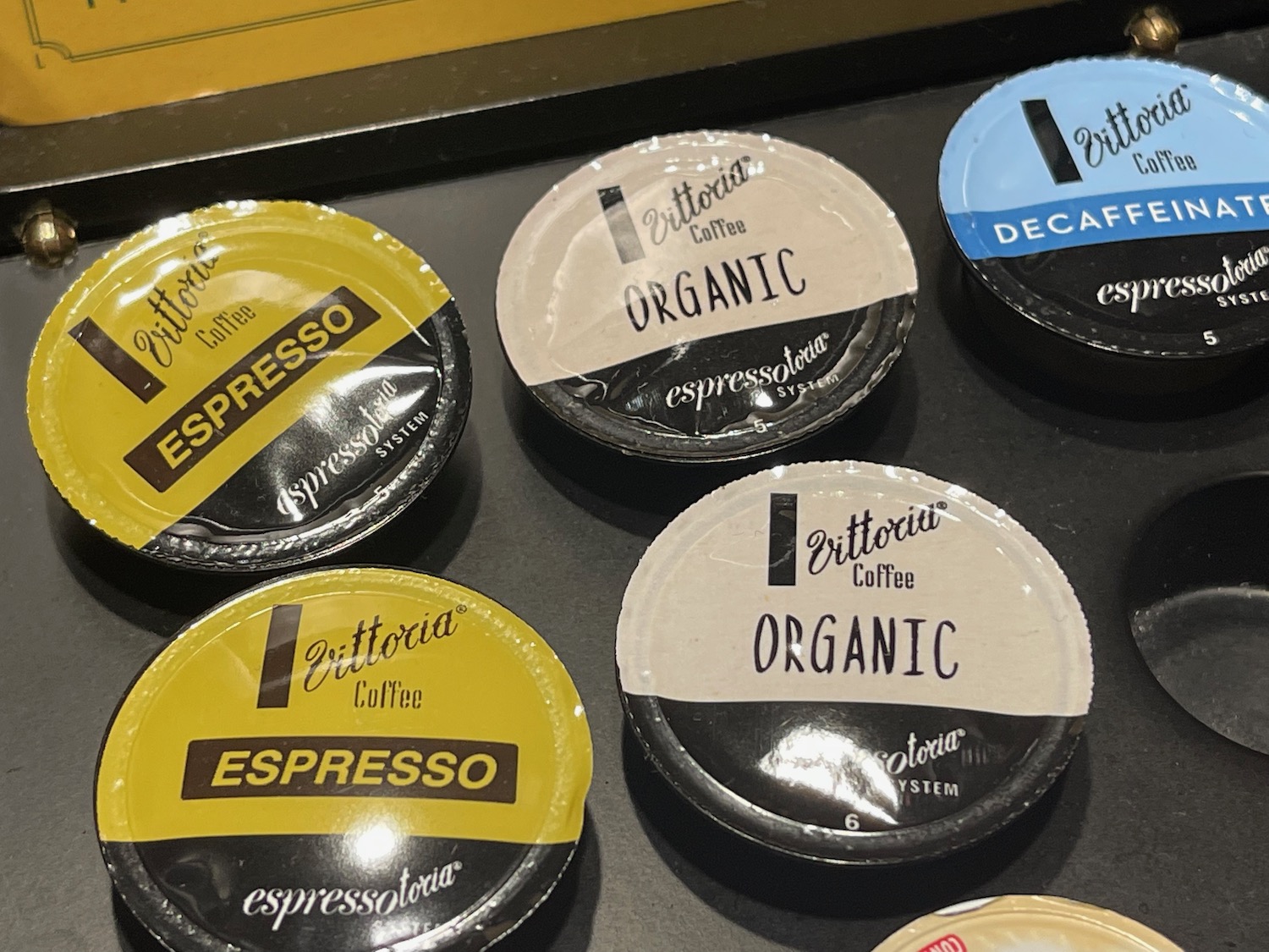 a group of coffee capsules