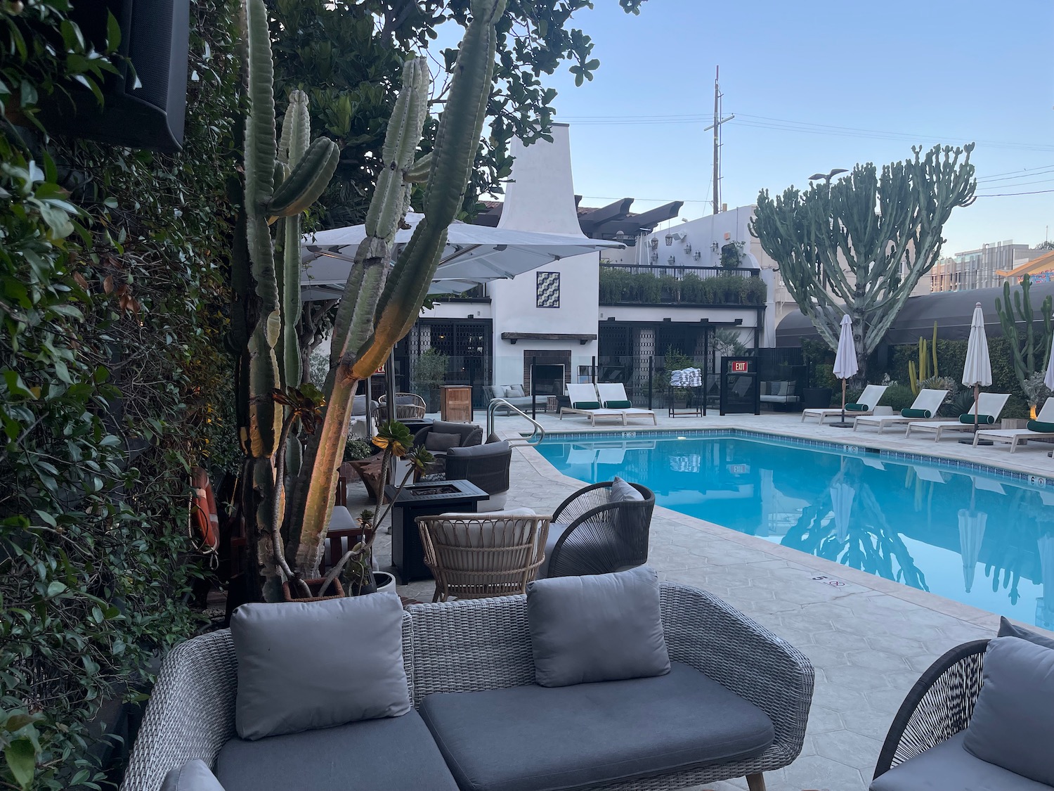 a pool with a couch and chairs