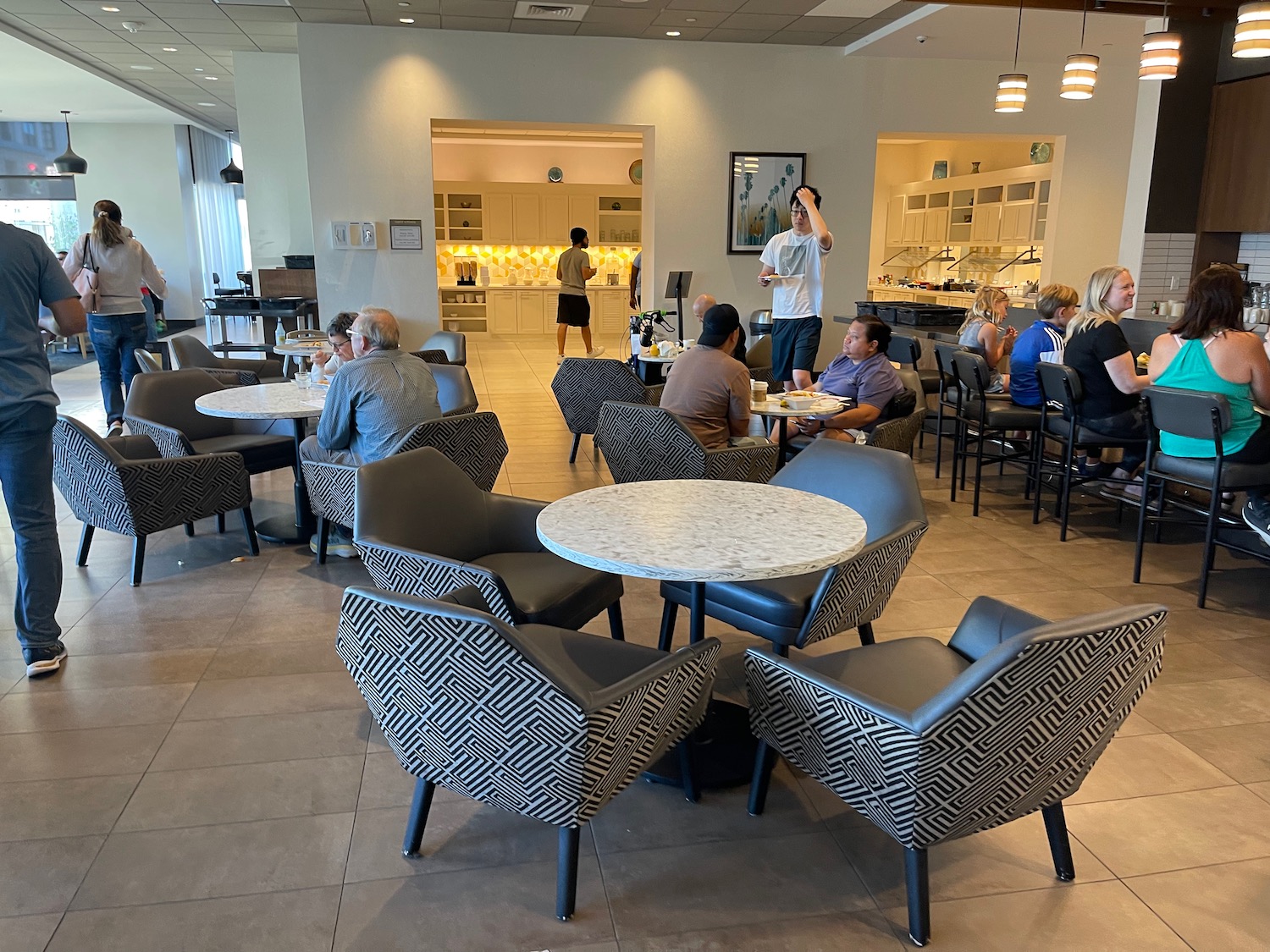 a group of people sitting around tables in a room