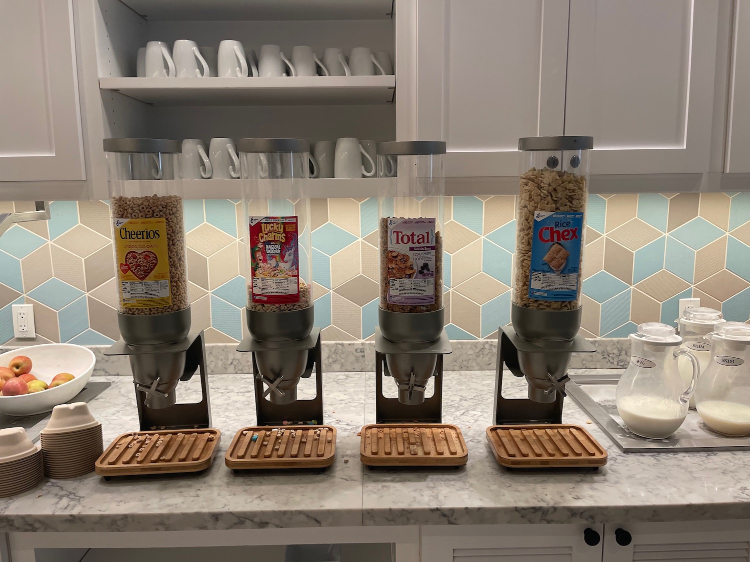 a group of cereal dispensers on a counter