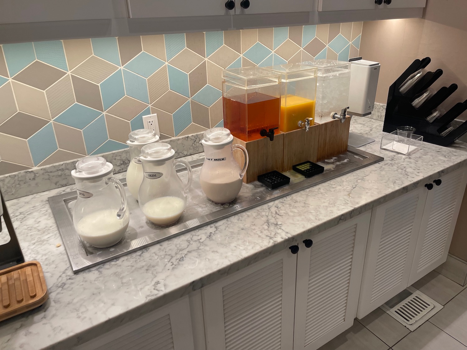 a group of jugs of liquid on a counter