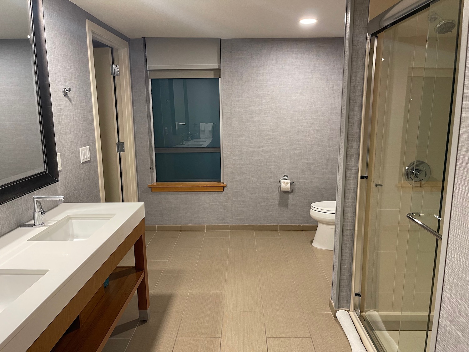 a bathroom with a shower and sink