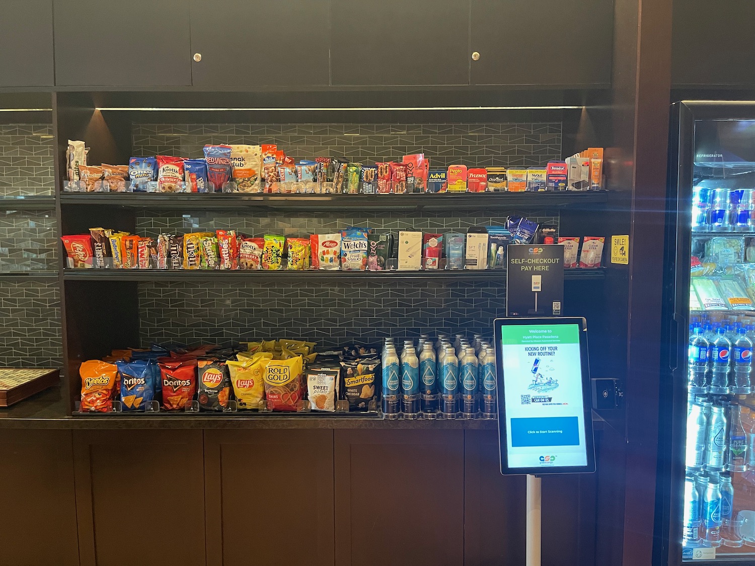 a shelf with snacks and drinks on it