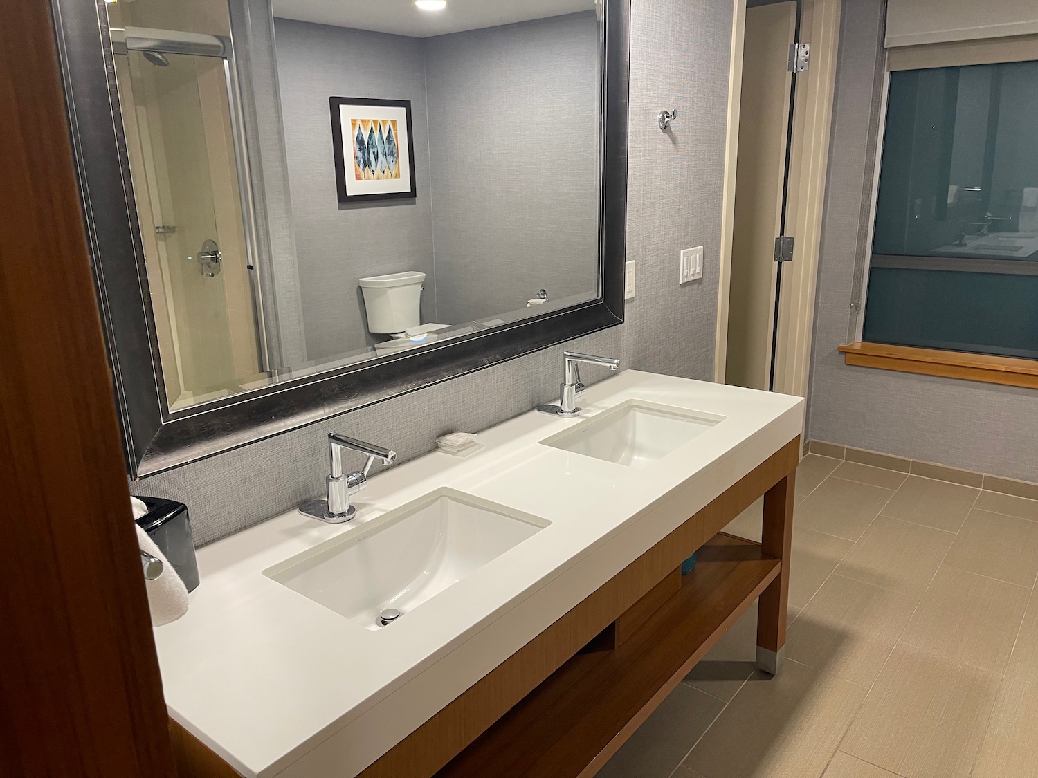 a bathroom with sinks and a mirror