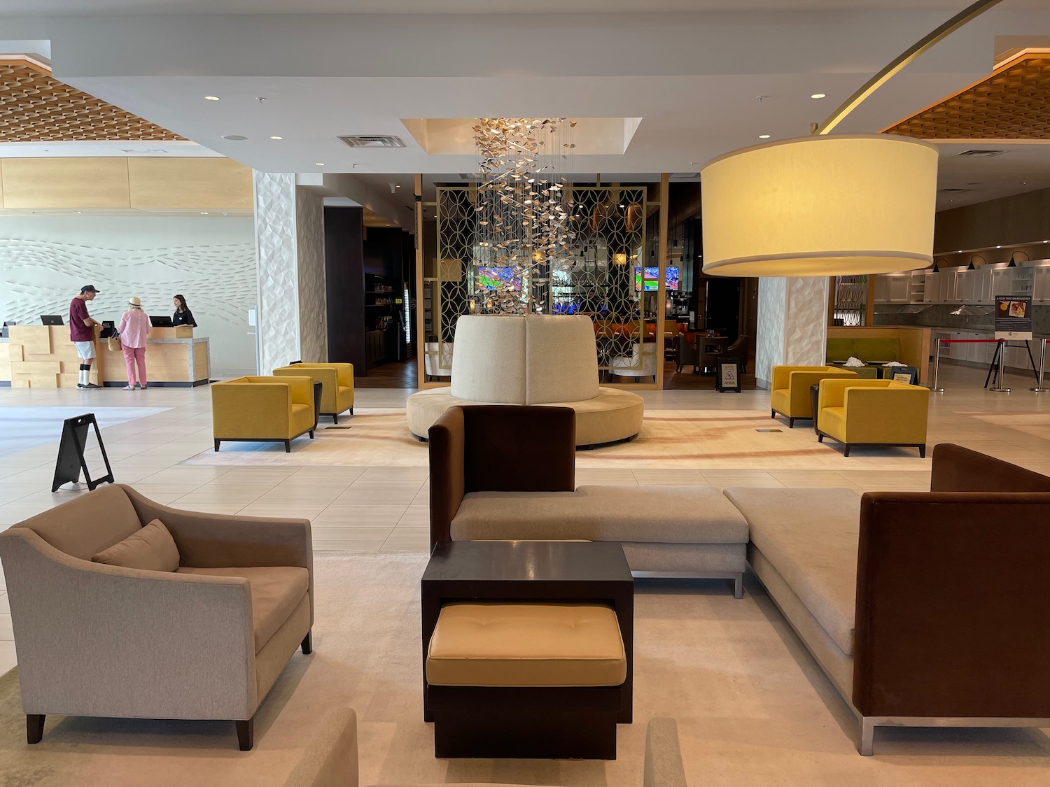 a lobby with a chandelier and couches