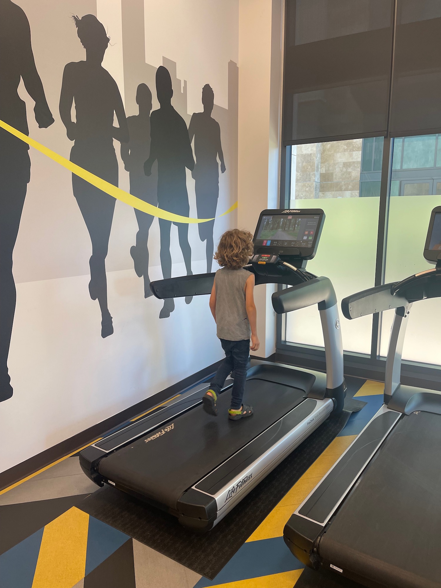 a child walking on a treadmill