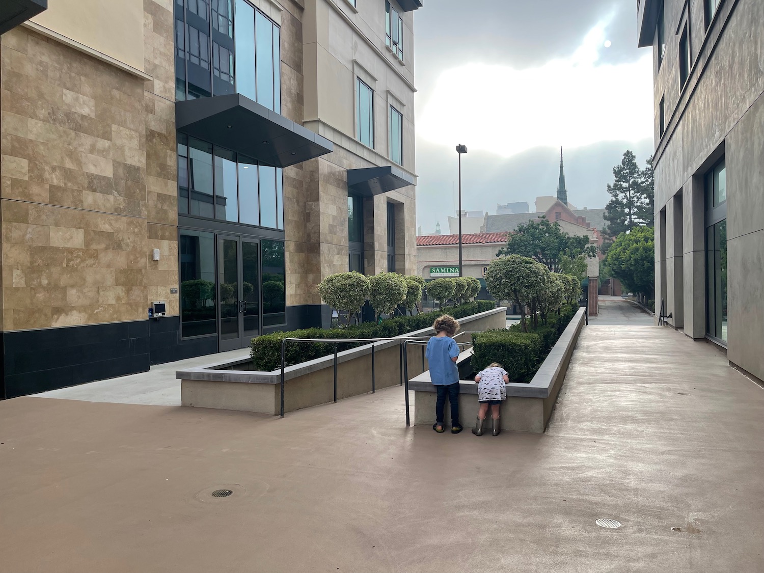 two children playing in a courtyard