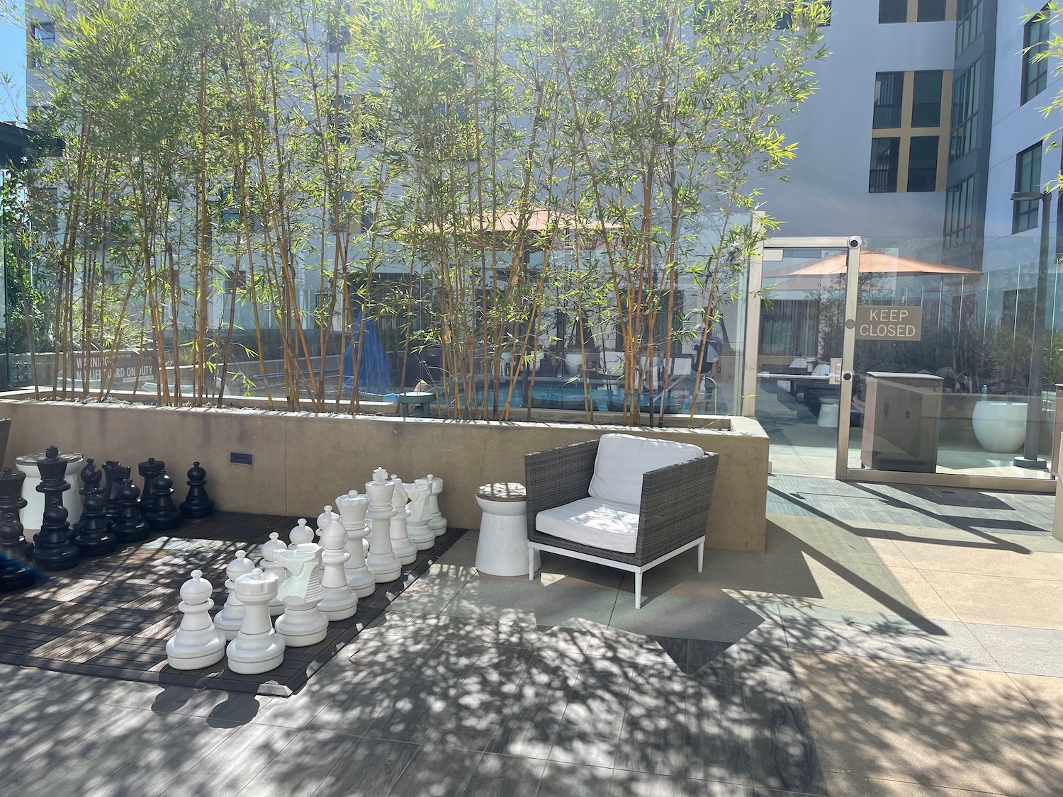 a chess board and chairs outside