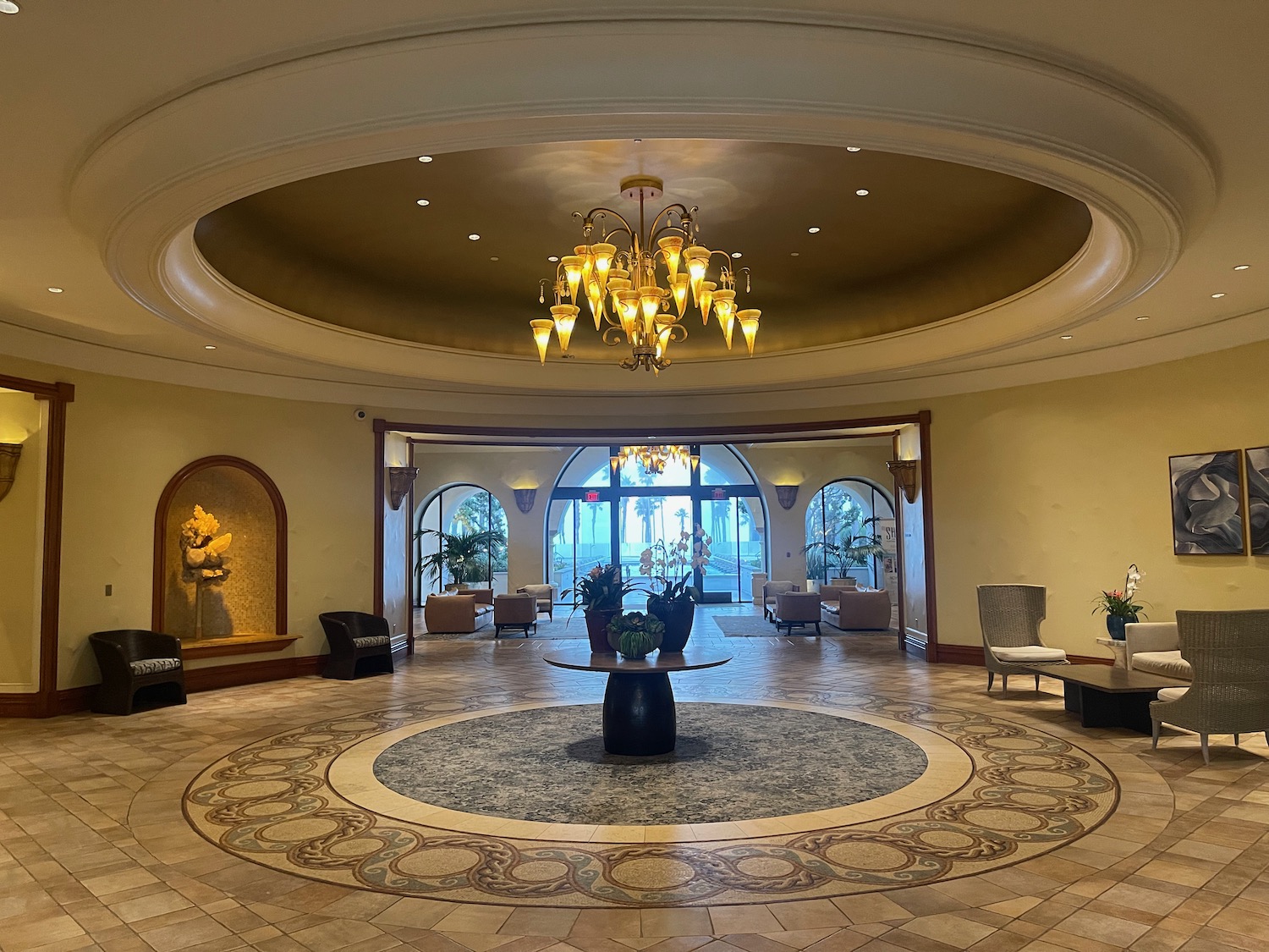 a large room with a round table and chairs