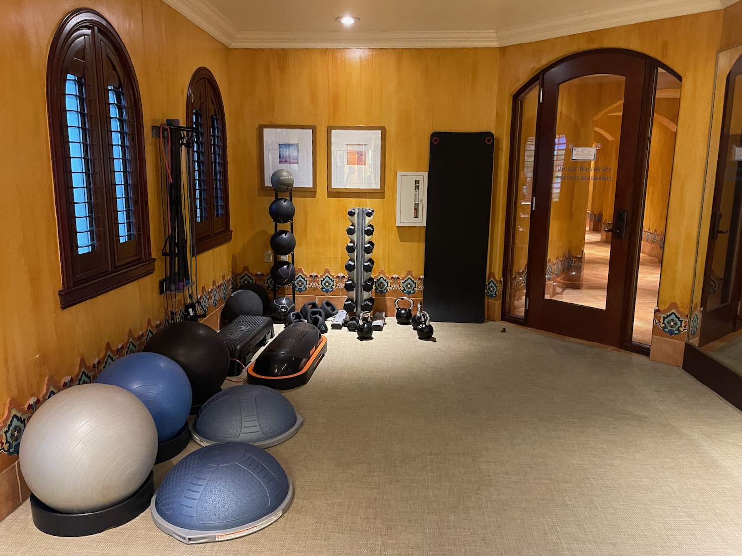 a room with exercise balls and weights