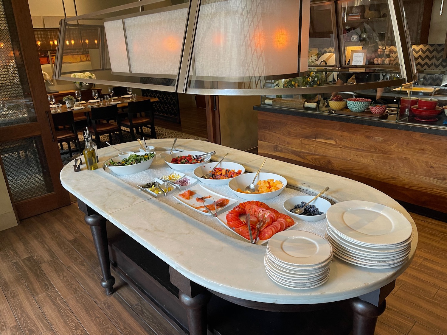 a buffet table with plates and food on it