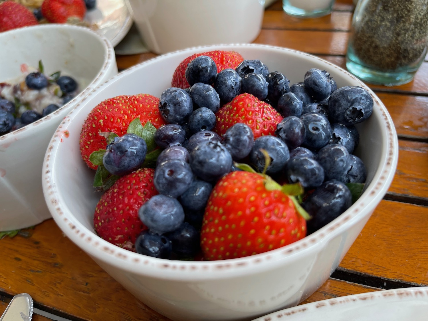 a bowl of blueberries and strawberries