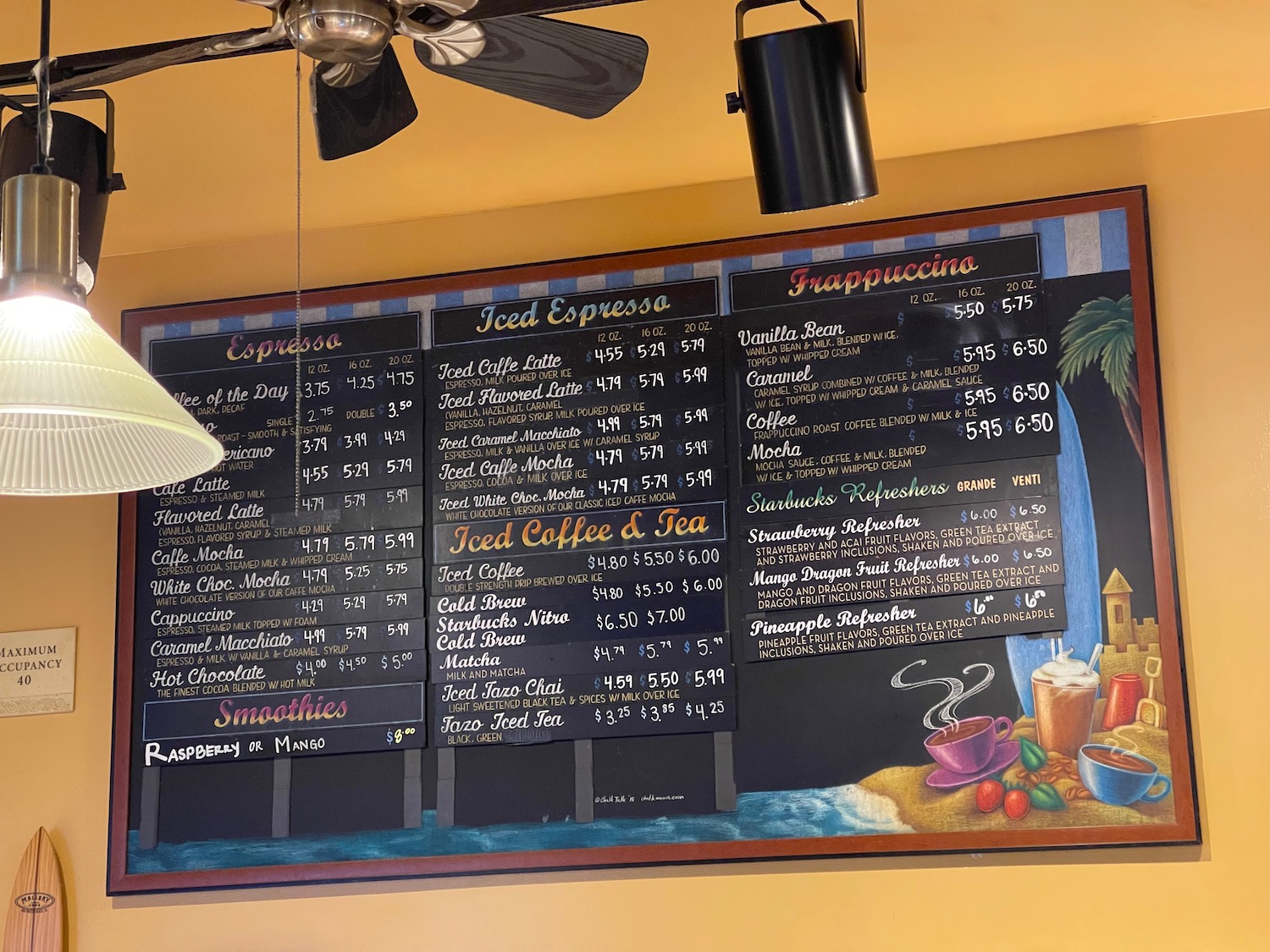 a menu board with a fan and ceiling fan