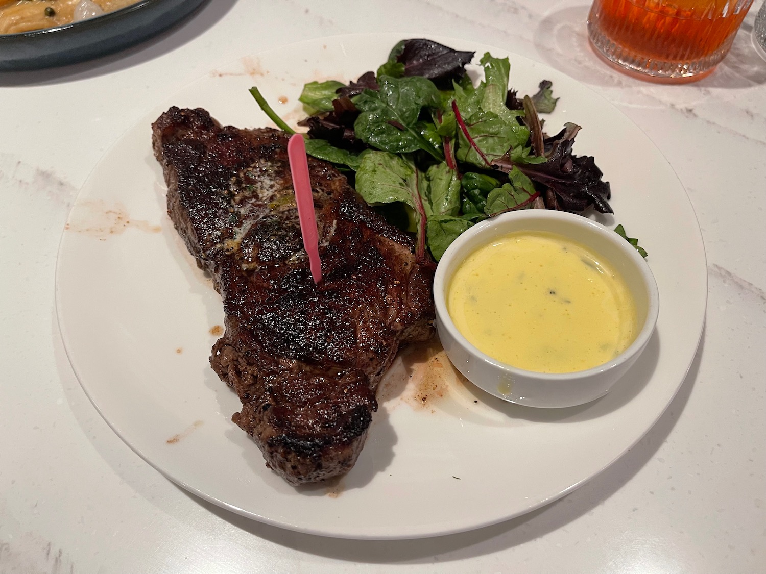 a plate of steak and salad