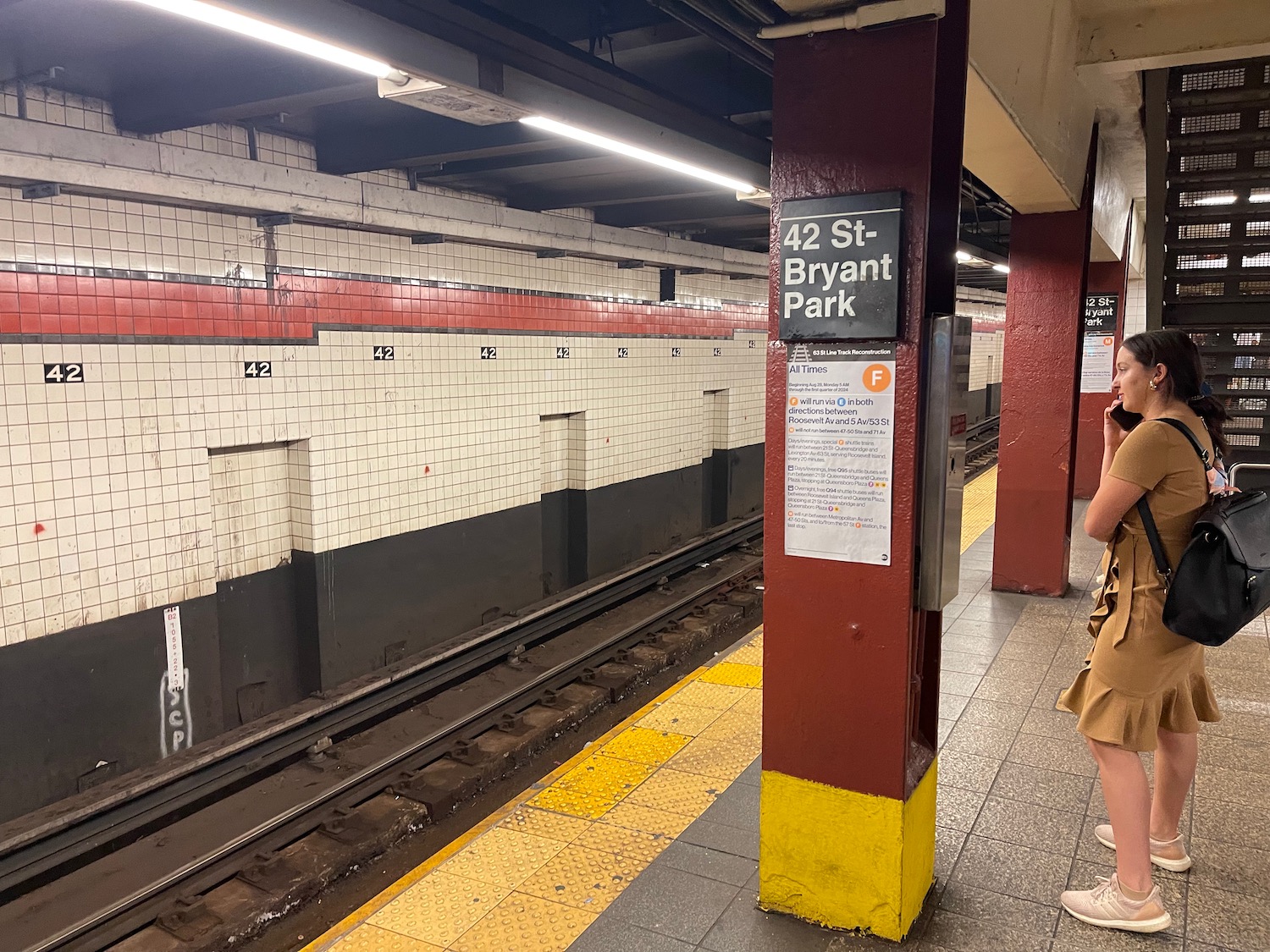 a train station with a sign