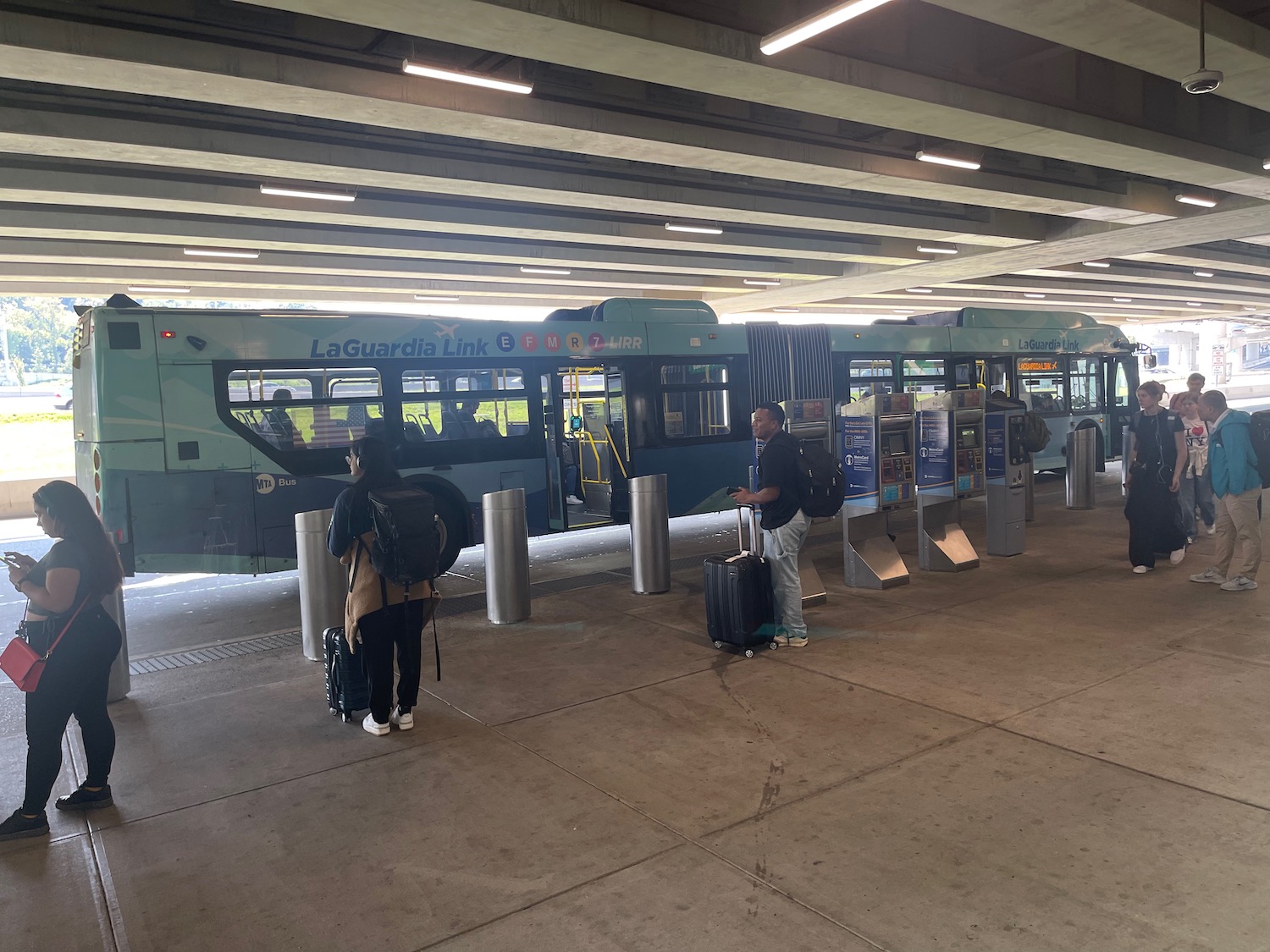 people standing in a train station