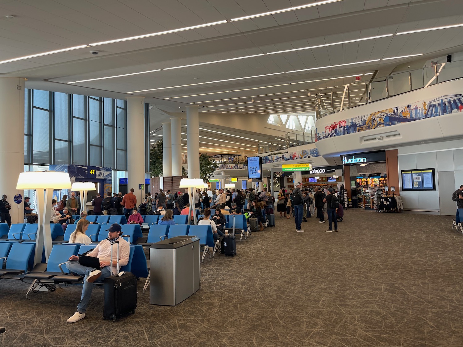 a group of people in an airport terminal