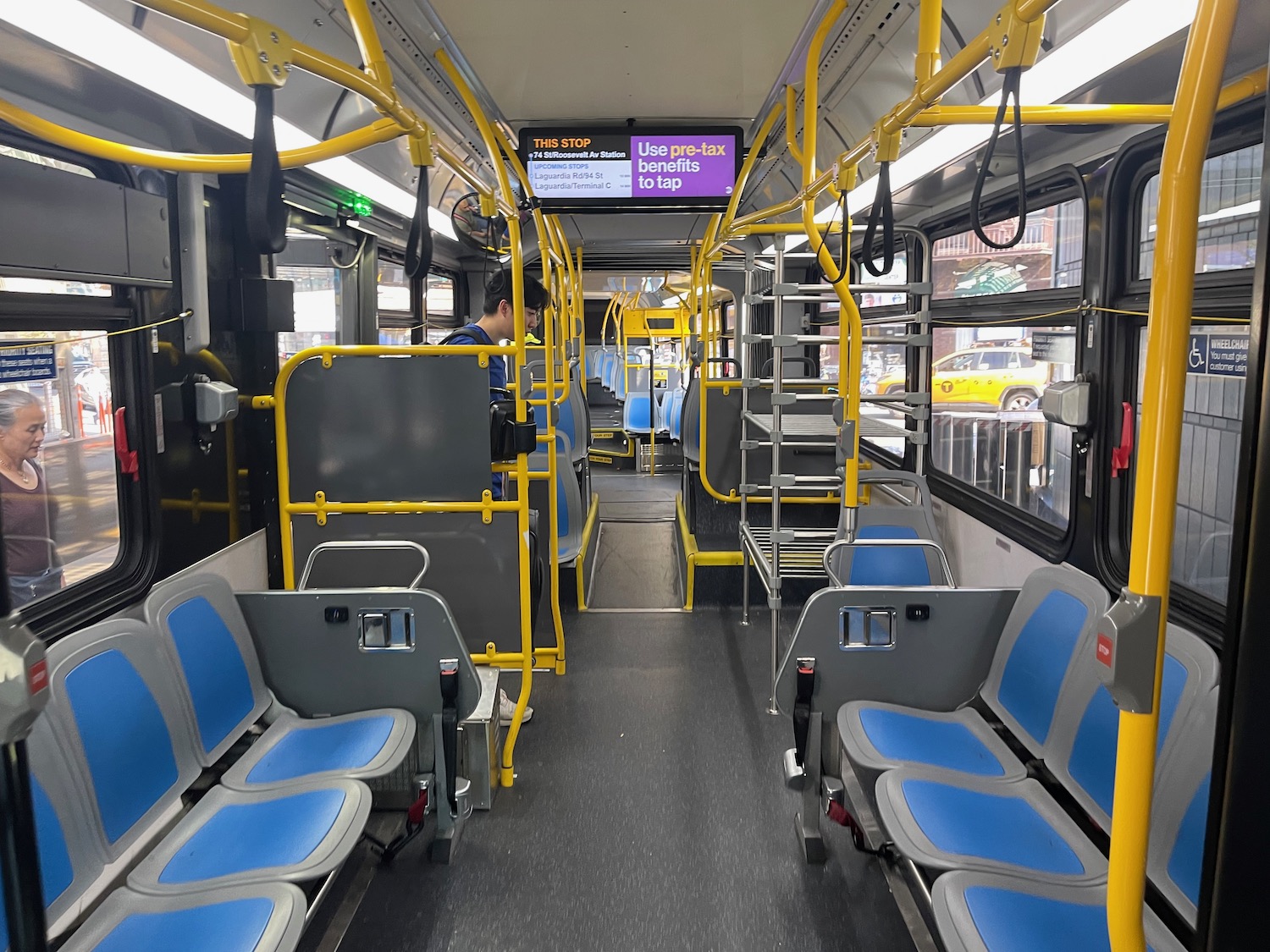 inside a bus with blue seats