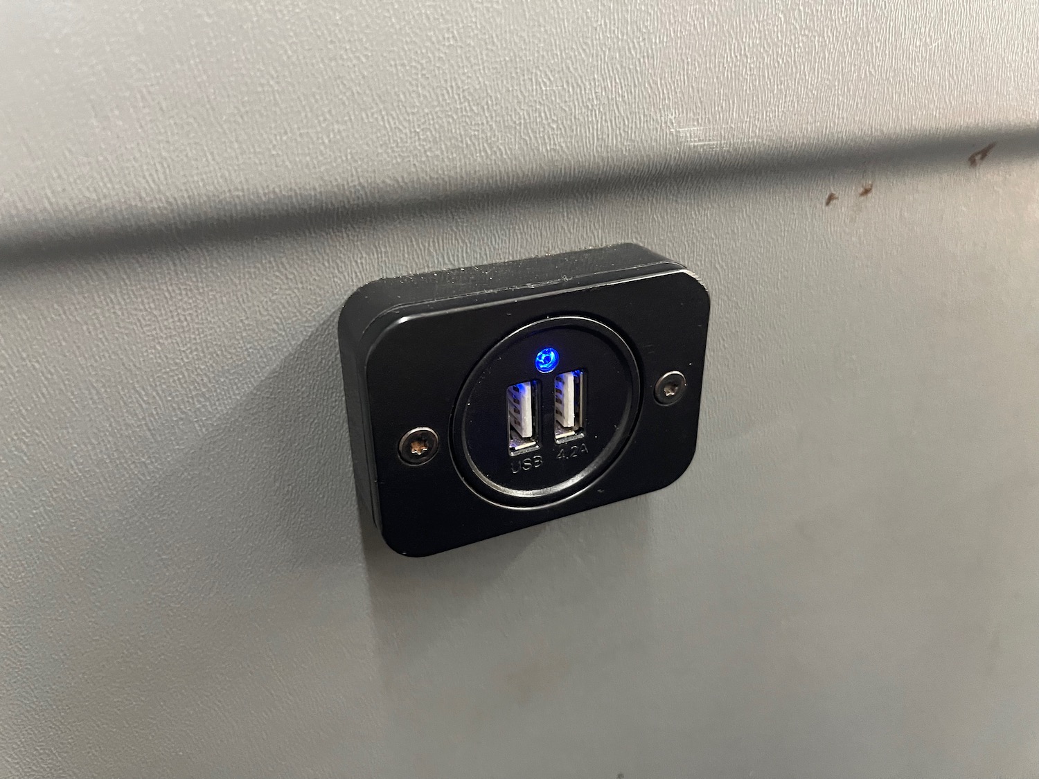 a black usb port on a wall