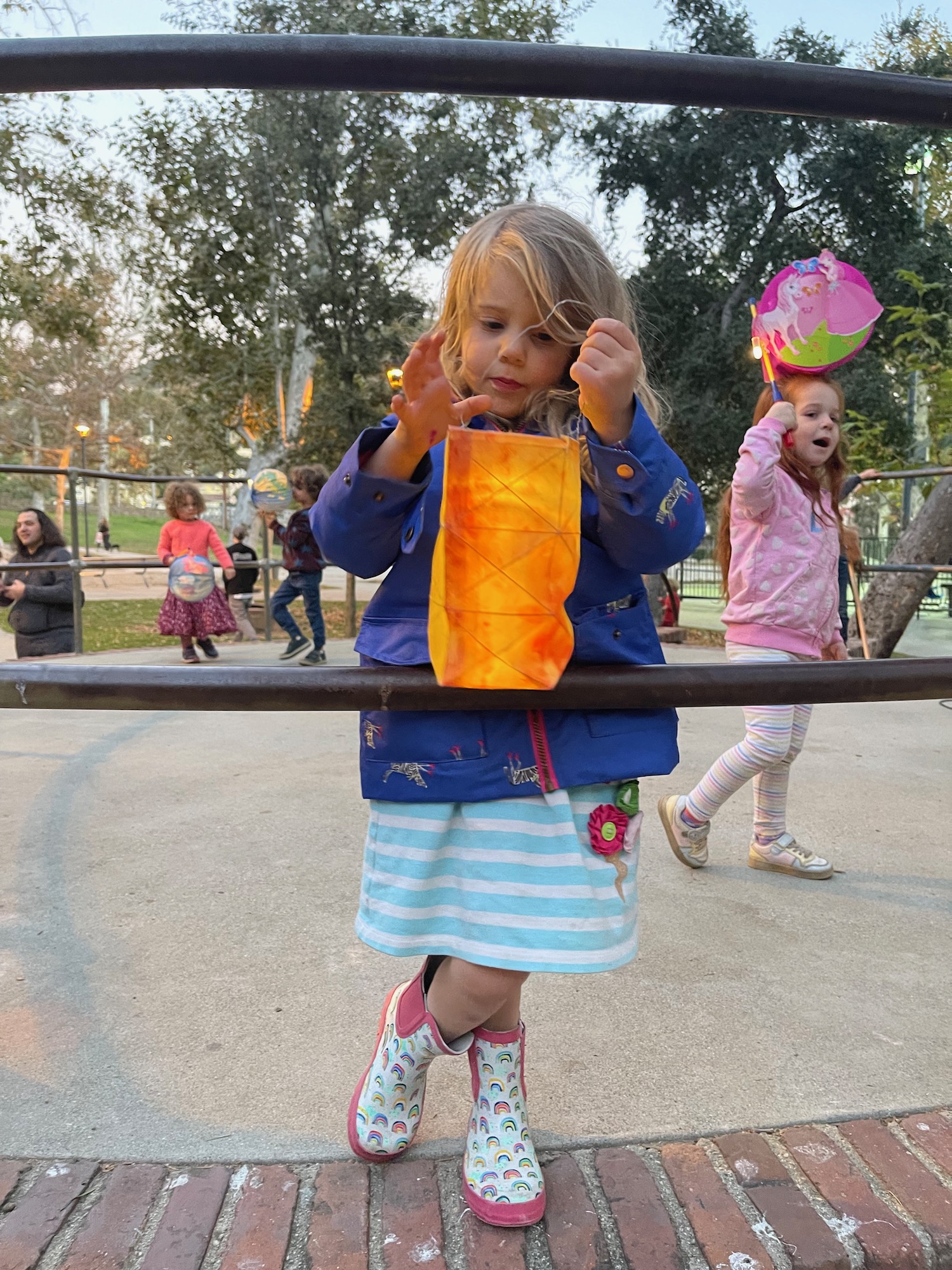 a girl holding a bag on a rail