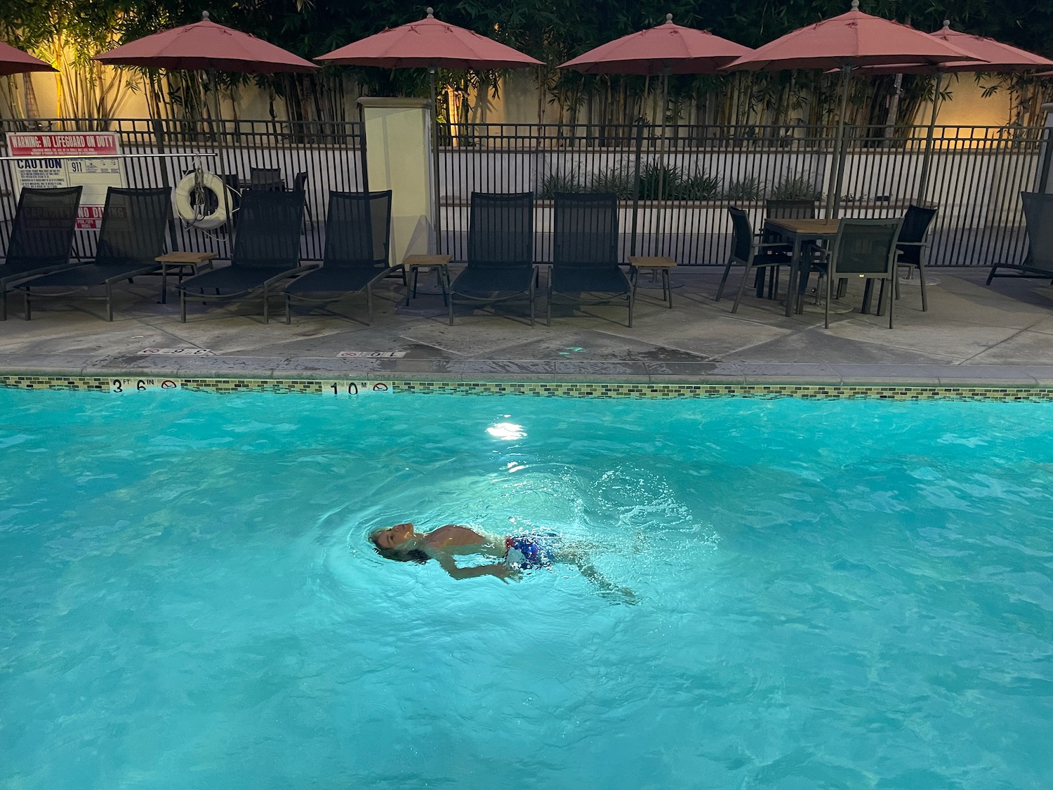 a person swimming in a pool