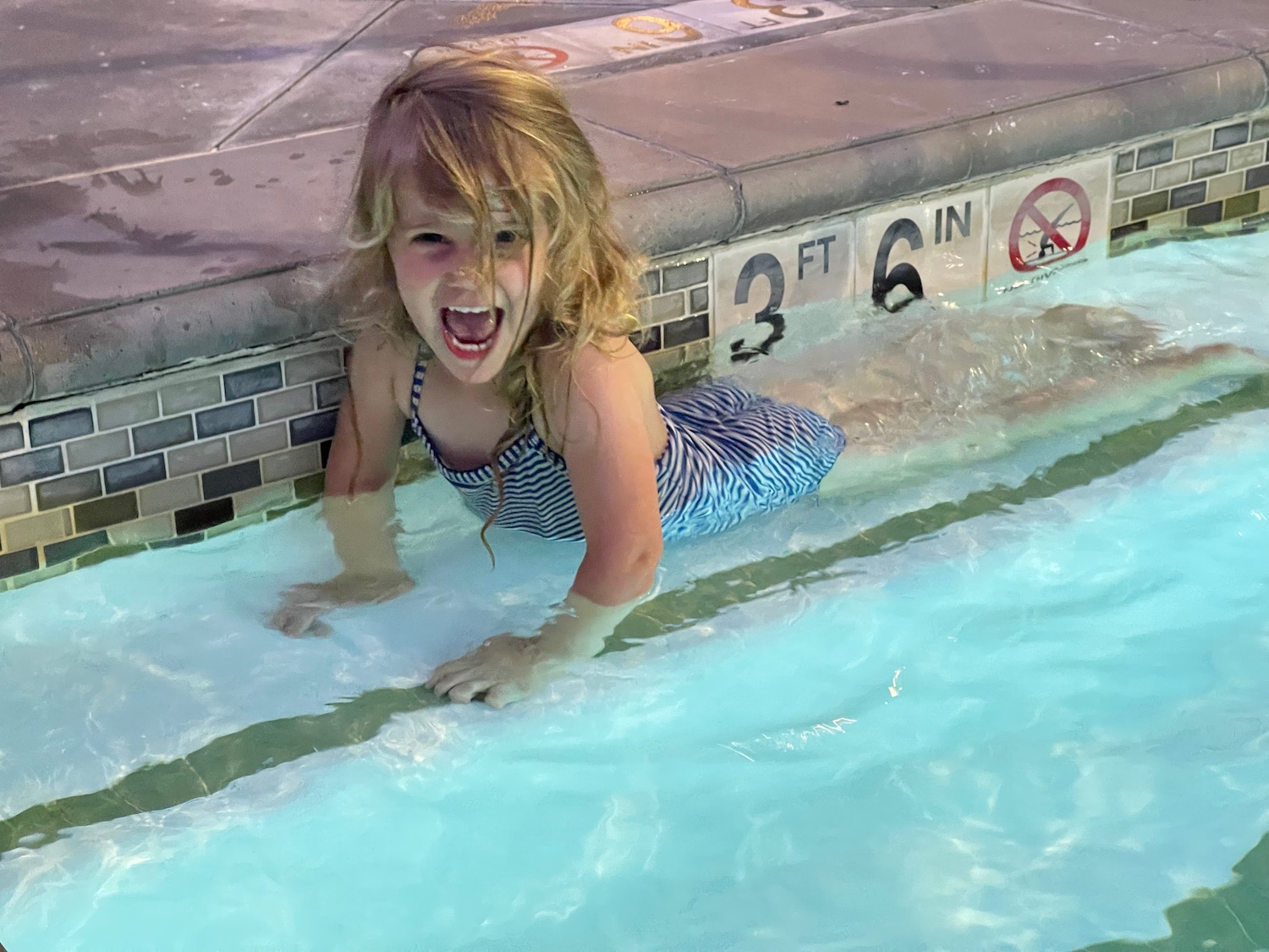 a girl in a swimming pool