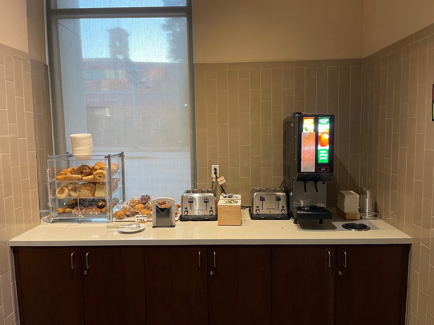 a coffee machine and bread on a counter