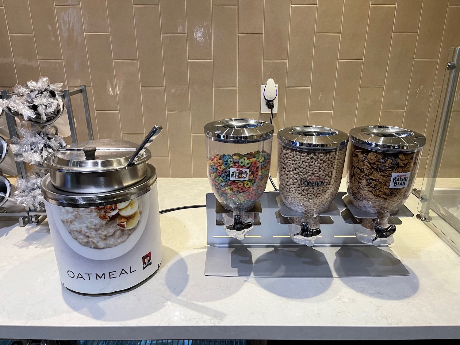 a group of cereal dispensers on a counter