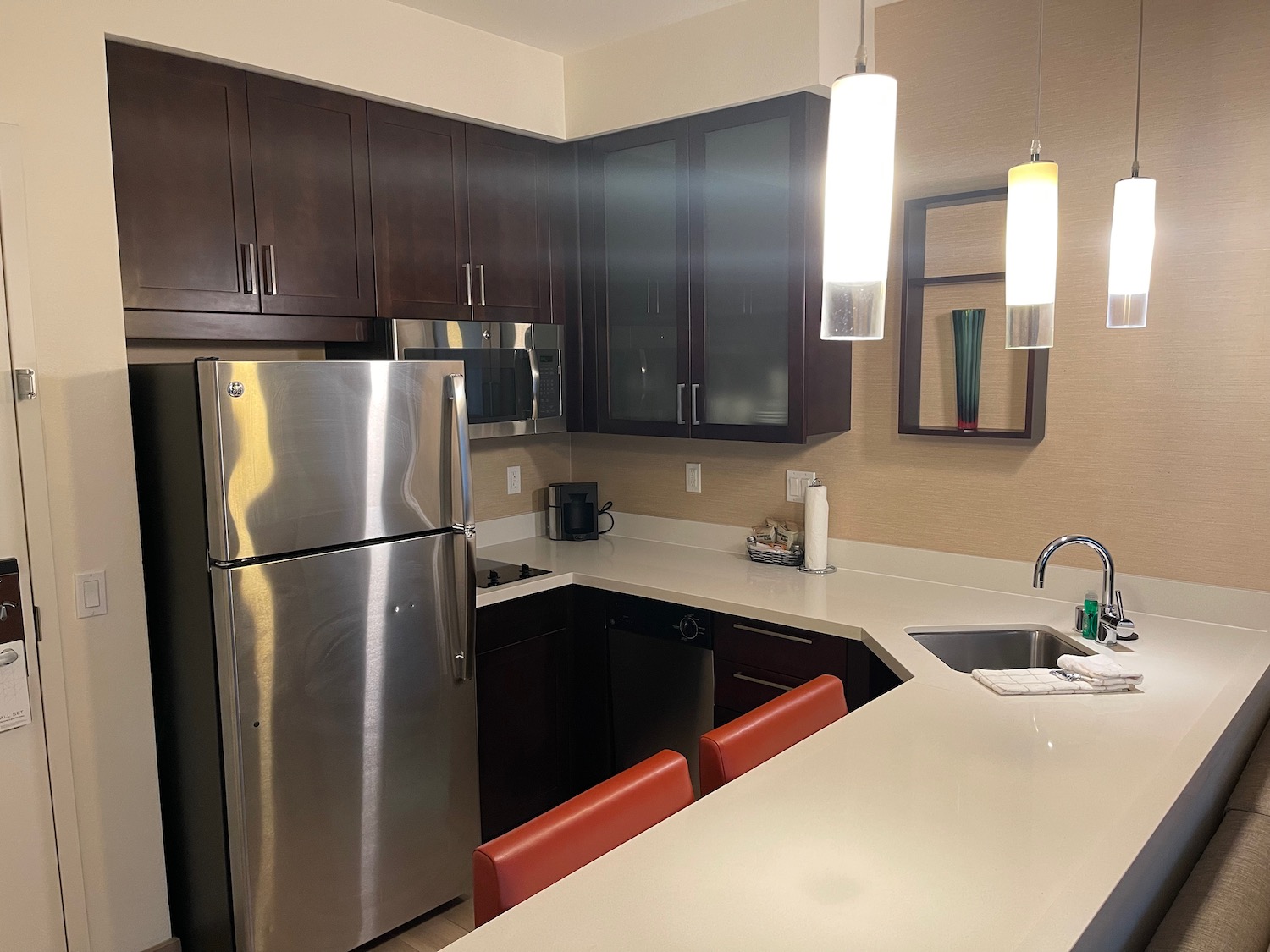 a kitchen with a refrigerator and a sink